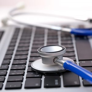 Stethoscope on laptop - Computer repair and maintenance concept